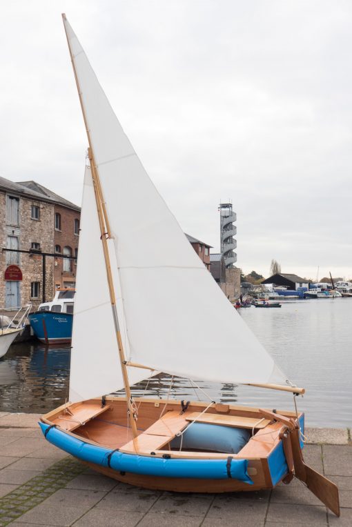 seahopper folding Kondor with blue PVC ends and white sails out of the water on Exeter Quay